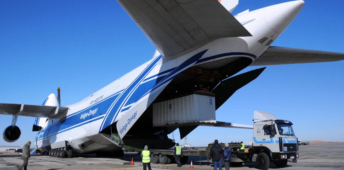 antonov-air-freight (1) 24617969 - baikonur, kazakhstan - november 11, 2013. russian volga-dnepr antonov an-124 long-range heavy transport plane is being unloaded in yubileiny airport.